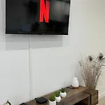 Em *
